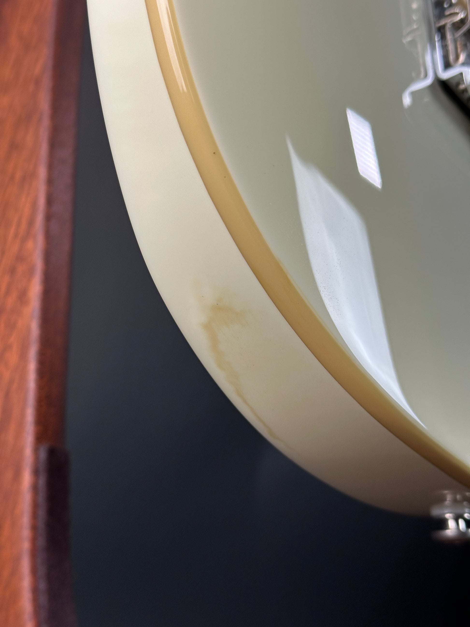 Discoloration in finish of Used Ernie Ball Music Man Reflex White.