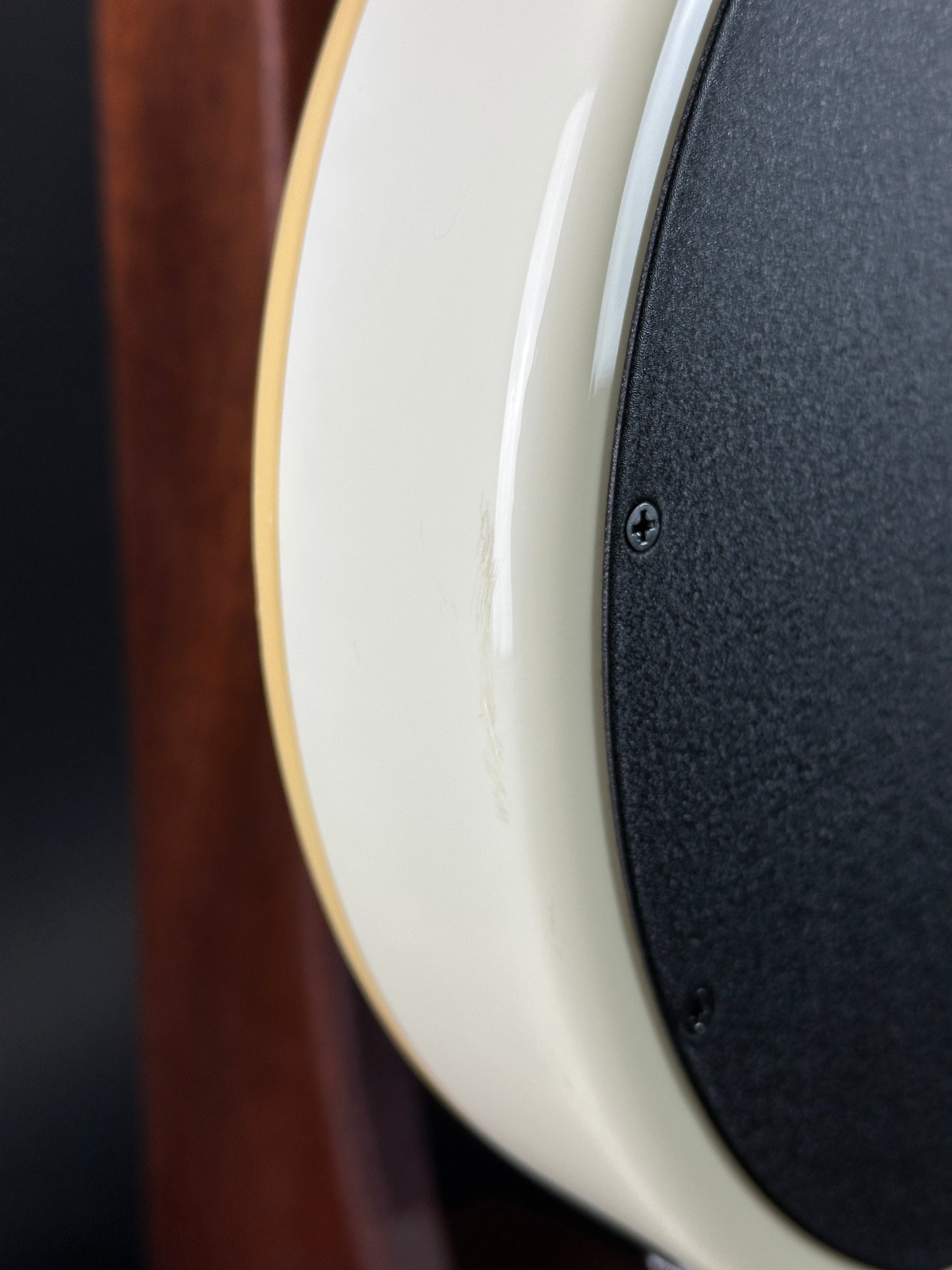 Scuff on bottom edge of Used Ernie Ball Music Man Reflex White.