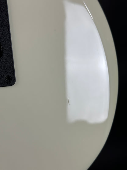 Ding on back of Used Ernie Ball Music Man Reflex White.