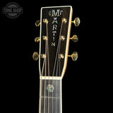 Headstock of Martin Custom Shop  41 Style Dread Adirondack/Pacific Big Leaf Flamed Maple.