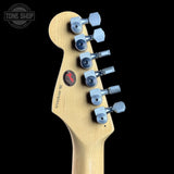 Guitar headstock with tuning pegs on a black background, featuring the Tone Shop logo.