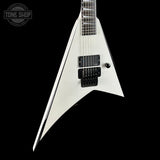 White electric guitar with a black pickguard on a black background, featuring 'Tone Shop' branding.