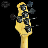 Close-up of a guitar neck with tuning pegs on a black background, featuring 'Tone Shop' branding.