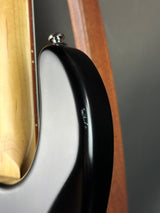 Close-up of a guitar's soundhole with a blurred background