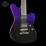 Electric guitar with purple and black finish on a black background