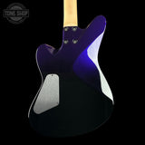 Electric guitar with a purple and white design on a black background, featuring the Tone Shop logo.