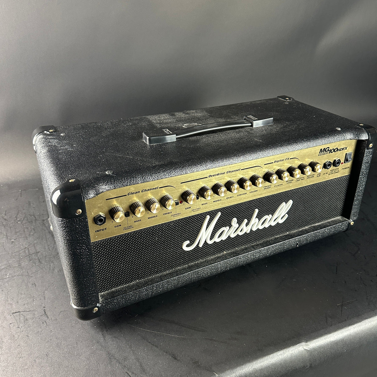 Marshall guitar amplifier head on a gray surface