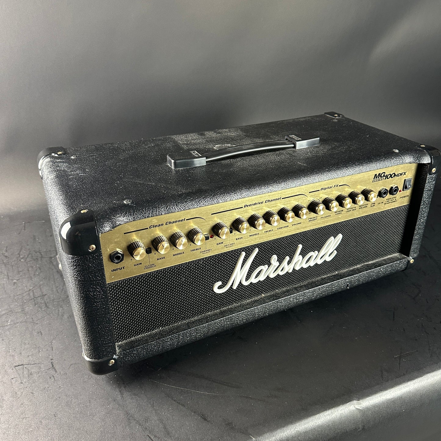 Marshall guitar amplifier head on a gray surface