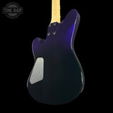Purple electric guitar body with a visible brand logo on a black background