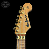 Guitar headstock with 'Jackson' branding on a black background