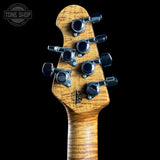 Guitar headstock with tuning pegs on a black background, featuring the Tone Shop logo.