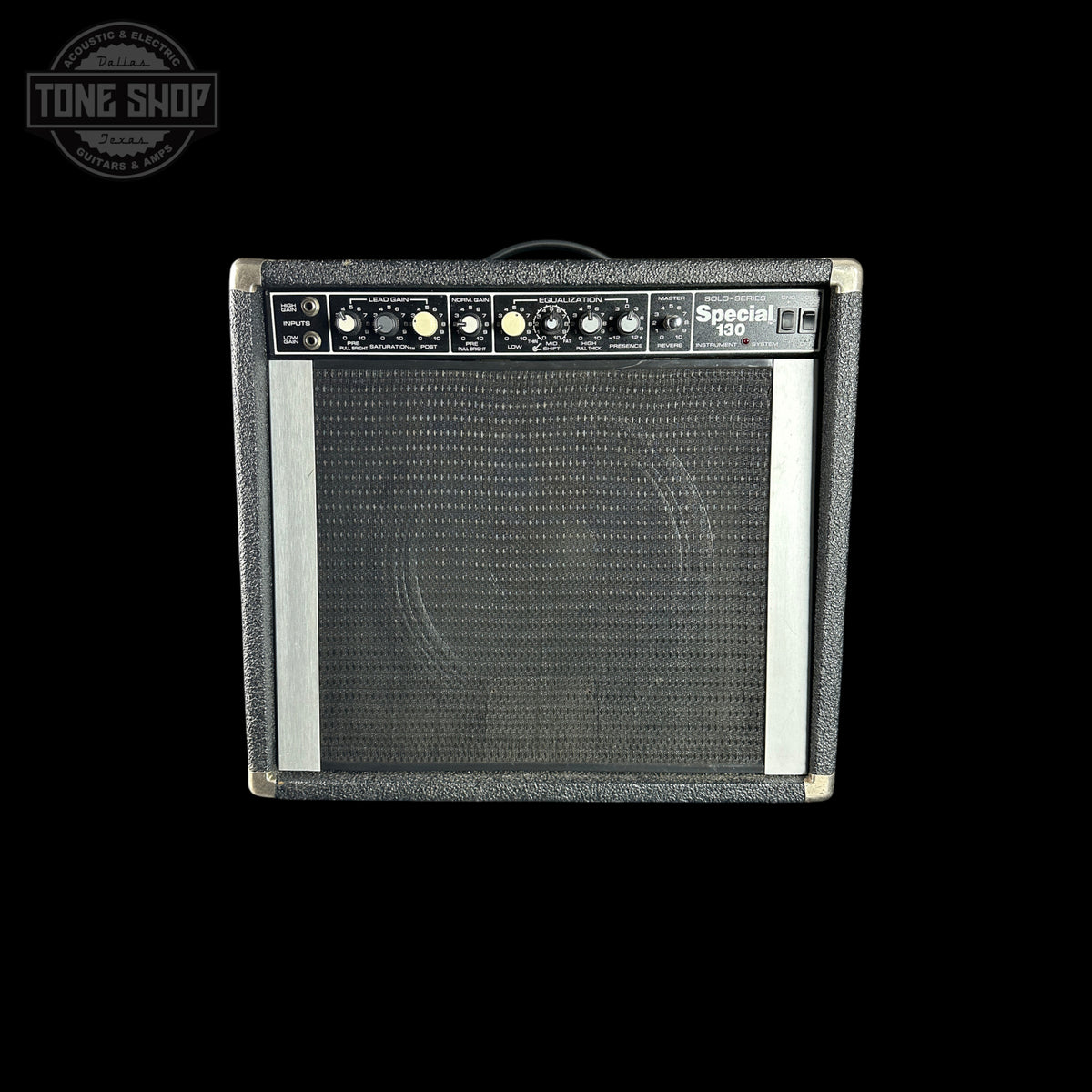 A black and gray Peavey Special 150 guitar amplifier against a solid black background, featuring a textured gray front grille, control knobs, and a white Peavey logo.
