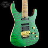 Green electric guitar with a black background