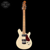 Electric guitar with a white pickguard and red pickguard on a black background, featuring the Tone Shop logo.