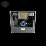 A vintage Tweedler Dual Fx Pedal power supply amplifier, shown from the back with the side panel removed to reveal the internal heatsink, fan, and wiring. The unit features a black textured exterior, a gold-colored heatsink, and a blue-accented fan.