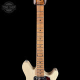Electric guitar with a visible brand logo on a black background