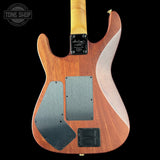 Back view of a wooden electric guitar with visible brand logo on a black background