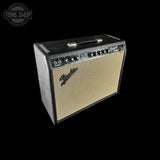 A Fender D1000X guitar amplifier with a black textured cabinet, cream-colored front grille, and a top carry handle, shown against a solid black background.