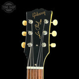 Gibson Les Paul guitar headstock with brand name on a black background