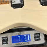 Digital scale displaying weight of a guitar, with a focus on the digital readout.