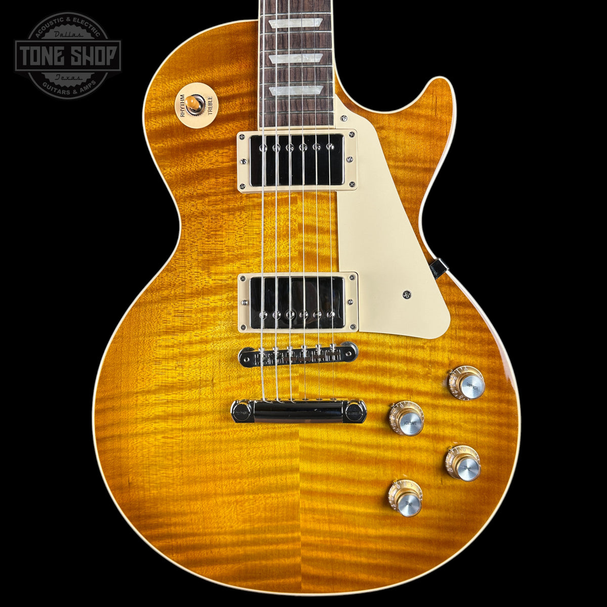 Electric guitar with a sunburst finish on a black background, featuring the Tone Shop logo.