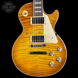 Electric guitar with a sunburst finish on a black background, featuring the Tone Shop logo.