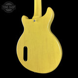 Yellow electric guitar body on a black background with 'Tone Shop' logo.