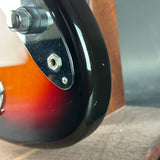 Close-up of a guitar's headstock with tuning pegs.