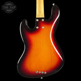 Electric guitar with a sunburst finish on a black background, featuring the Tone Shop logo.