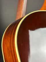 Close-up of a guitar's wooden neck and fretboard