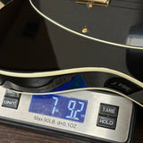 Digital kitchen scale displaying weight with a black lid on top