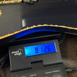 Used Ibanez Korn K7 on scale displaying weight.