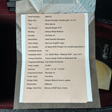 Technical specifications sheet for a guitar on a textured surface