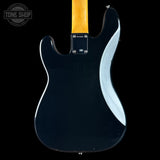 The back of a Fender electric guitar with a glossy black body, a maple neck, and a white pickguard, shown against a solid black background.