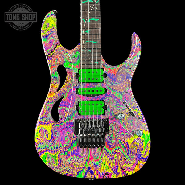 Colorful electric guitar with a psychedelic design on a black background, featuring the 'Tone Shop' logo.