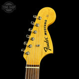 Fender Mustang guitar headstock on a black background