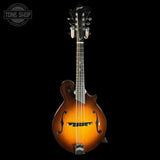 A Cavaiah electric mandolin with a sunburst finish, shown against a solid black background. The mandolin features a glossy amber-to-brown gradient body, a dark fretboard, and a black headstock with the Cavaiah logo.