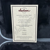 A custom instrument certificate card from Jackson Custom Shop, detailing a Polka Dot Ink White JCS 5L 20 ft paddle deck bike rack, displayed on a dark textured background.