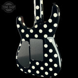 The back of a black electric guitar with a white polka-dot pattern, shown against a solid black background. A 'TONE SHOP' watermark is visible in the top-left corner.