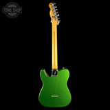 A green electric guitar shown from the back against a solid black background, featuring a natural maple neck and chrome tuning pegs. A Tone Shop watermark is visible in the top-left corner.