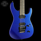 A blue metallic electric guitar with black hardware, shown from a side angle against a solid black background. A Tone Shop watermark is visible in the top-left corner.