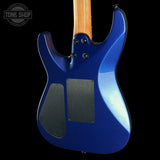 Close-up of the back of a blue electric guitar against a black background, showing the glossy blue body, black pickguard covers, and part of the natural wood neck.
