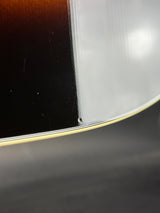 Close-up of a guitar's soundhole and body
