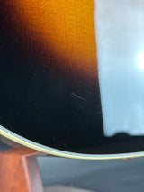 Close-up of a guitar's soundhole with a blurred background
