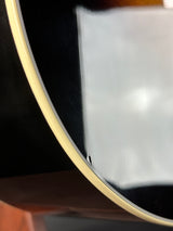 Close-up of a guitar with a reflective surface