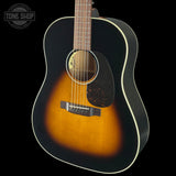 Acoustic guitar with a sunburst finish on a black background, featuring the Tone Shop logo.