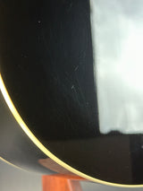 Close-up of a black surface with visible scratches