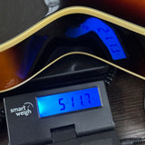 Used Gretsch Historic Series G3900 on scale displaying weight.