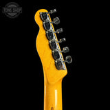 Guitar headstock with tuning pegs on a black background, featuring 'Tone Shop' logo.