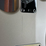 Scratch on back of Used 1997 Fender US Roadhouse Stratocaster Shoreline Gold.